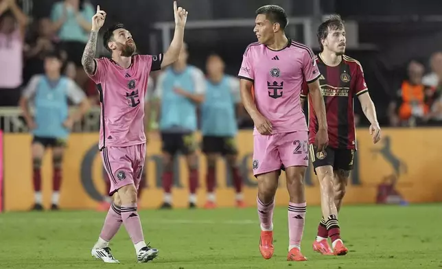 Inter Miami forward Lionel Messi (10) celebrates after scoring a goal during the second half of an MLS playoff opening round soccer match against Atlanta United, Saturday, Nov. 9, 2024, in Fort Lauderdale, Fla. (AP Photo/Rebecca Blackwell)