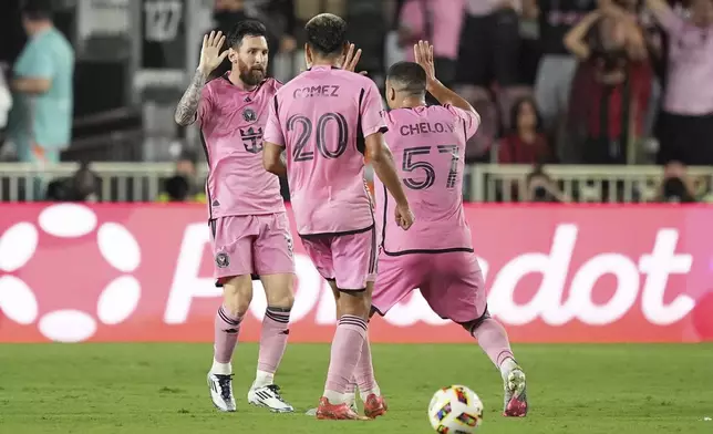 Inter Miami forward Lionel Messi (10) celebrates after scoring a goal during the second half of an MLS playoff opening round soccer match against Atlanta United, Saturday, Nov. 9, 2024, in Fort Lauderdale, Fla. (AP Photo/Rebecca Blackwell)