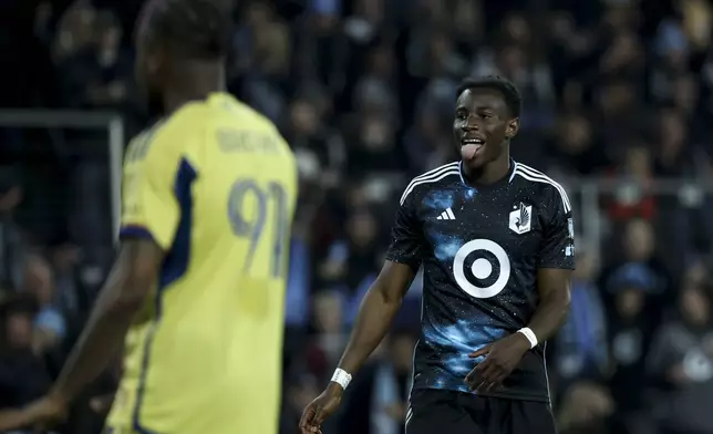 Minnesota United forward Kelvin Yeboah, right, reacts during the first half of a first-round soccer match of the MLS Cup playoffs against Real Salt Lake in St. Paul, Minn., Saturday, Nov. 2, 2024. (AP Photo/Ellen Schmidt)