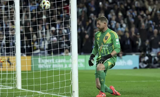 Real Salt Lake goalkeeper Zac MacMath reacts after missing a save during a penalty shoot out of a first-round soccer match of the MLS Cup playoffs against the Minnesota United in St. Paul, Minn., Saturday, Nov. 2, 2024. (AP Photo/Ellen Schmidt)
