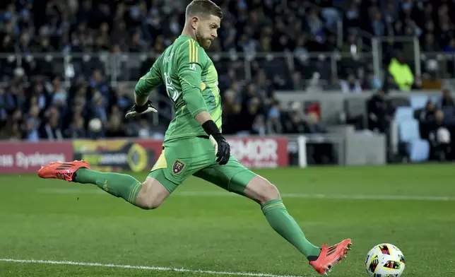 Real Salt Lake goalkeeper Zac MacMath (18) kicks the ball into play during the first half of a first-round soccer match of the MLS Cup playoffs against the Minnesota United in St. Paul, Minn., Saturday, Nov. 2, 2024. (AP Photo/Ellen Schmidt)