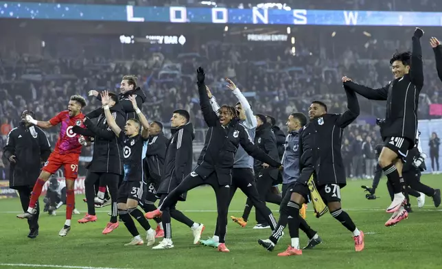 The Minnesota United celebrate after winning a first-round soccer match of the MLS Cup playoffs against Real Salt Lake in St. Paul, Minn., Saturday, Nov. 2, 2024. (AP Photo/Ellen Schmidt)