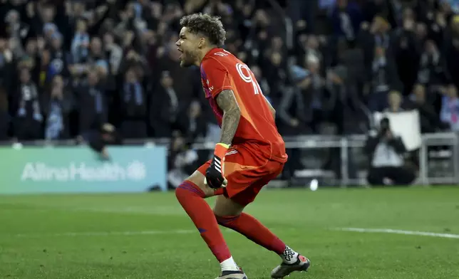Minnesota United goalkeeper Dayne St. Clair reacts after making a save on a penalty shoot out of a first-round soccer match of the MLS Cup playoffs against Real Salt Lake in St. Paul, Minn., Saturday, Nov. 2, 2024. (AP Photo/Ellen Schmidt)