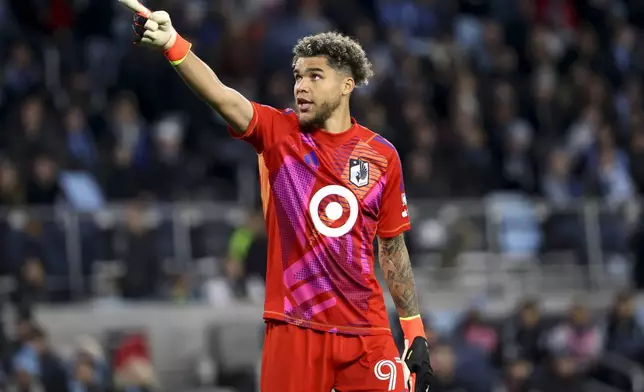 Minnesota United goalkeeper Dayne St. Clair (97) reacts to an official's call during the second half of a first-round soccer match of the MLS Cup playoffs against Real Salt Lake in St. Paul, Minn., Saturday, Nov. 2, 2024. (AP Photo/Ellen Schmidt)
