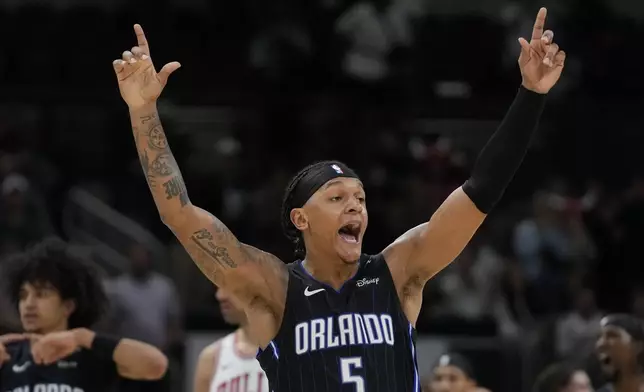 Orlando Magic forward Paolo Banchero reacts to sinking a 3-point shot before it was called no good during the second half of an NBA basketball game against the Chicago Bulls, Wednesday, Oct. 30, 2024, in Chicago. (AP Photo/Erin Hooley)