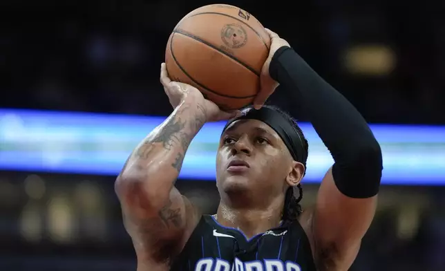 Orlando Magic forward Paolo Banchero shoots a free throw during the first half of an NBA basketball game against the Chicago Bulls, Wednesday, Oct. 30, 2024, in Chicago. (AP Photo/Erin Hooley)