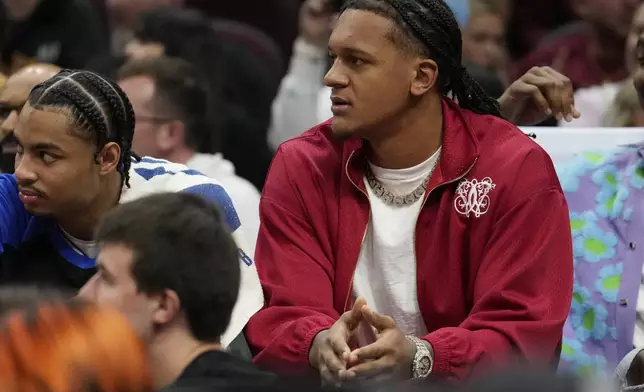 Injured Orlando Magic forward Paolo Banchero watches from the bench in the first half of an NBA basketball game against the Cleveland Cavaliers, Friday, Nov. 1, 2024, in Cleveland. (AP PhotoSue Ogrocki)