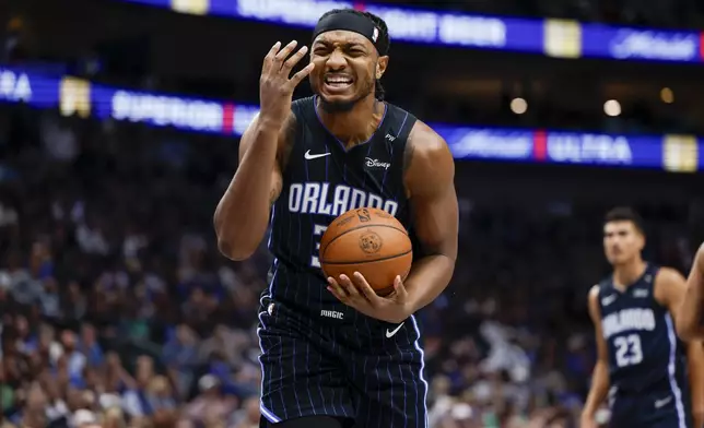 Orlando Magic center Wendell Carter Jr. (34) argues a foul call during the first half of an NBA basketball game against the Dallas Mavericks, Sunday, Nov. 3, 2024, in Dallas. (AP Photo/Gareth Patterson)