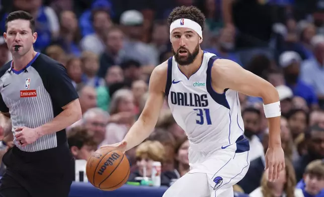 Dallas Mavericks guard Klay Thompson (31) runs downcourt during the first half of an NBA basketball game against the Orlando Magic, Sunday, Nov. 3, 2024, in Dallas. (AP Photo/Gareth Patterson)