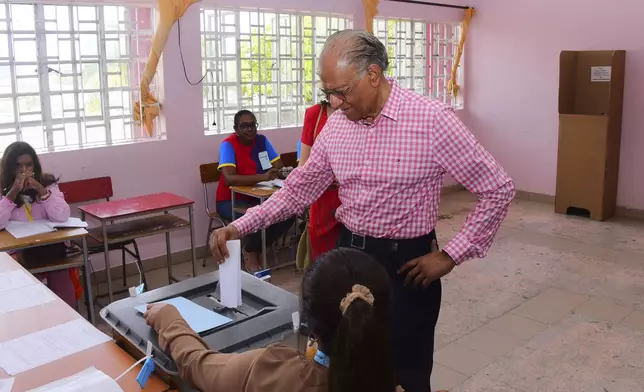 Leader of the Labour Party, Navin Ramgoolan, casts his vote in Mauritian elections in Port Louis, Sunday Nov. 10, 2024. (La Sentinelle via AP)