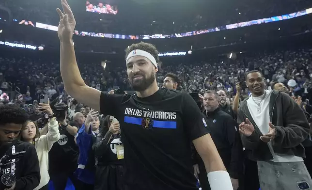 Dallas Mavericks guard Klay Thompson waves toward fans before an Emirates NBA Cup basketball game between the Golden State Warriors and the Mavericks in San Francisco, Tuesday, Nov. 12, 2024. (AP Photo/Jeff Chiu)