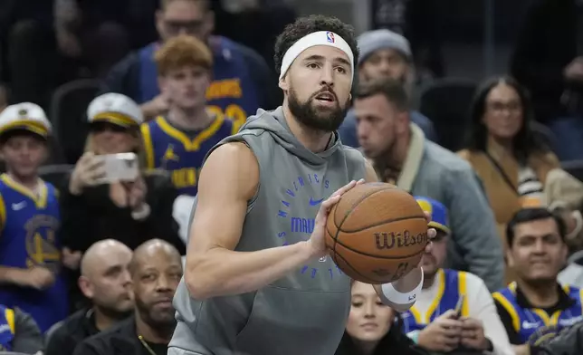 Dallas Mavericks guard Klay Thompson warms up before an Emirates NBA Cup basketball game against the Golden State Warriors in San Francisco, Tuesday, Nov. 12, 2024. (AP Photo/Jeff Chiu)