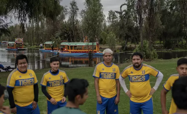 Amateur players take a break on a soccer field in the Xochimilco borough of Mexico City, Sunday, Oct. 20, 2024. (AP Photo/Felix Marquez)