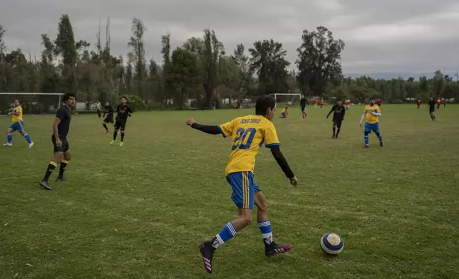 Amateur soccer players from the Chivas team play on a field in the Xochimilco borough of Mexico City, on Sunday, October 20, 2024. (AP Photo/Felix Marquez)