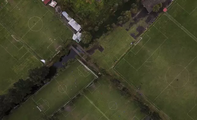 New soccer fields can be seen where ancestral floating gardens once grew in the Xochimilco borough of Mexico City, on Sunday, October 20, 2024. (AP Photo/Felix Marquez)