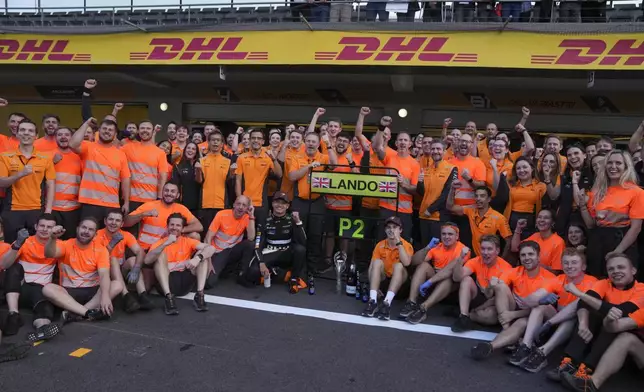 McLaren driver Lando Norris of Britain, center, and team celebrate his second-place finish in the Formula One Mexico Grand Prix auto race at the Hermanos Rodriguez racetrack in Mexico City, Sunday, Oct. 27, 2024. (AP Photo/Fernando Llano)