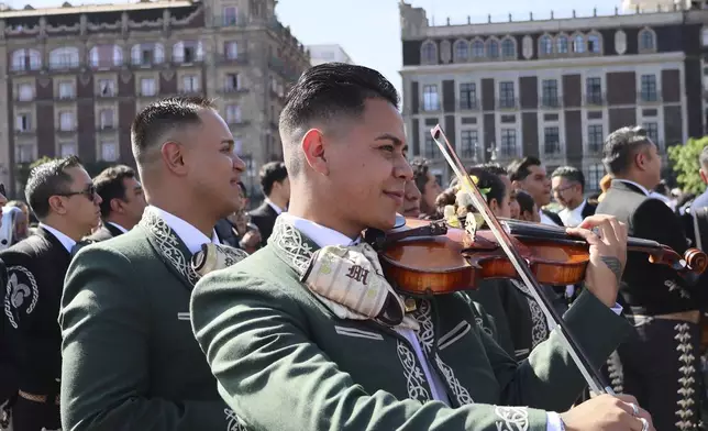 Musicians gather to break the record of most mariachis performing in unison, at the Zocalo, Mexico City's main square, Sunday, Nov. 10, 2024. (AP Photo/Ginnette Riquelme)