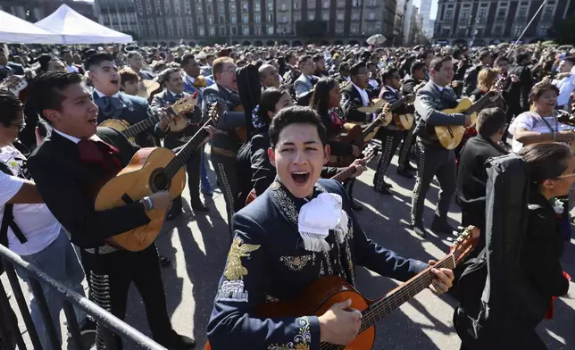 Musicians gather to break the record of most mariachis performing in unison, at the Zocalo, Mexico City's main square, Sunday, Nov. 10, 2024. (AP Photo/Ginnette Riquelme)