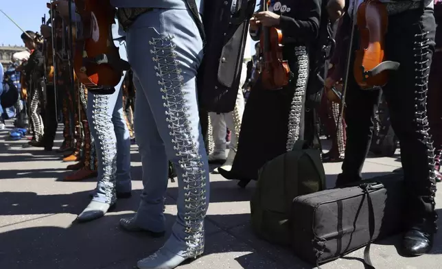 Musicians gather to break the record of most mariachis performing in unison, at the Zocalo, Mexico City's main square, Sunday, Nov. 10, 2024. (AP Photo/Ginnette Riquelme)