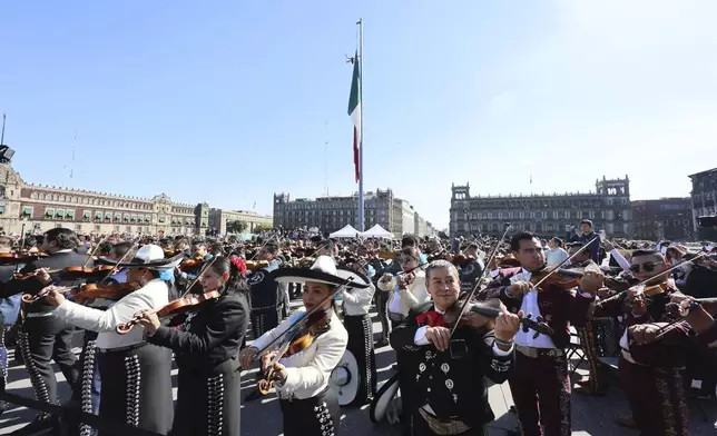 Musicians gather to break the record of most mariachis performing in unison, at the Zocalo, Mexico City's main square, Sunday, Nov. 10, 2024. (AP Photo/Ginnette Riquelme)