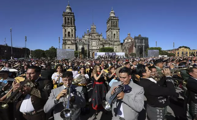 Musicians gather to break the record of most mariachis performing in unison, at the Zocalo, Mexico City's main square, Sunday, Nov. 10, 2024. (AP Photo/Ginnette Riquelme)