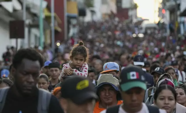 Migrants depart Tapachula, Mexico, hoping to reach the country's northern border and ultimately the United States, Tuesday, Nov. 5, 2024. (AP Photo/Moises Castillo)