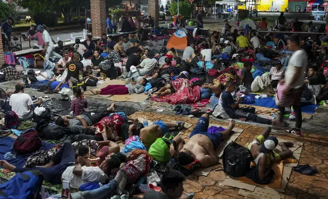 Migrants camp after a day's walk from Tapachula, Mexico, hoping to reach the country's northern border and ultimately the United States, on Tuesday, Nov. 5, 2024 (AP Photo/Moises Castillo)