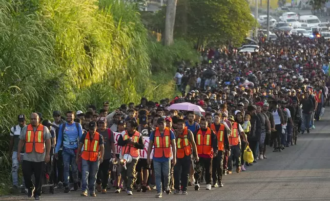 Migrants depart Tapachula, Mexico, in hopes of reaching the country's northern border and ultimately the United States, Tuesday, Nov. 5, 2024. (AP Photo/Moises Castillo)