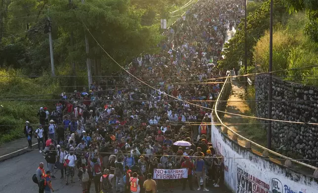 Migrants depart Tapachula, Mexico, in hopes to reach the country's northern border and ultimately the United States, Tuesday, Nov. 5, 2024. (AP Photo/Moises Castillo)