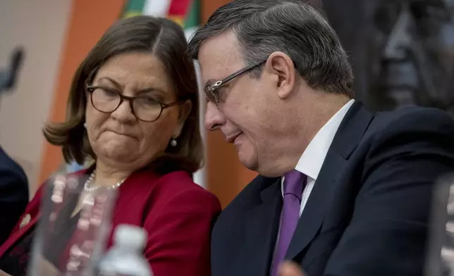 FILE - Mexican Ambassador Martha Barcena, left, and Foreign Affairs Minister Marcelo Ebrard attend a news conference at the Mexican Embassy in Washington, June 3, 2019, as part of a Mexican delegation in Washington for talks following trade tariff threats from the Trump Administration. (AP Photo/Andrew Harnik, File)