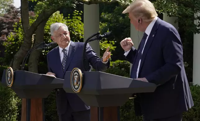 FILE - Mexico's President Andres Manuel Lopez Obrador, left, and President Donald Trump hold a joint news conference at the White House in Washington, July 8, 2020. (AP Photo/Evan Vucci, File)