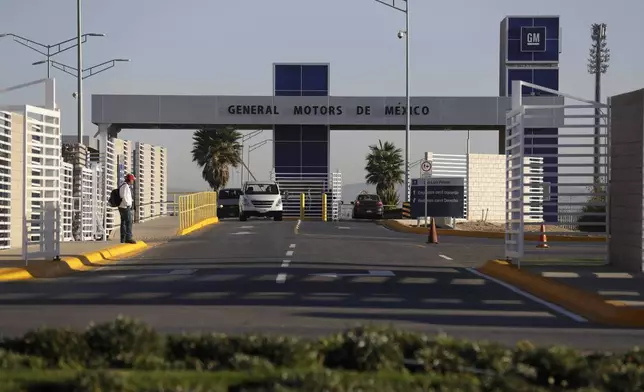 FILE - Cars exit the General Motors assembly plant in Villa de Reyes, outside San Luis Potosi, Mexico, Jan. 4, 2017. (AP Photo/Rebecca Blackwell, File)