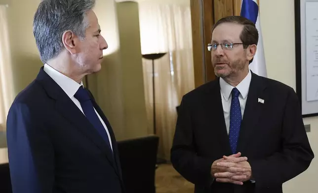 FILE- U.S. Secretary of State Antony Blinken, left, speaks with Israeli President Isaac Herzog, in Tel Aviv, Israel, on Nov. 3, 2023. (Jonathan Ernst/Pool Photo via AP, File)