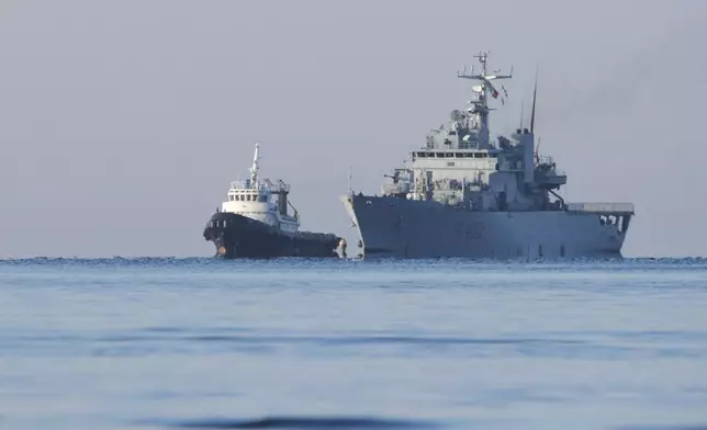 The Italian navy ship Libra approaches the port of Shengjin, northwestern Albania, Friday, Nov. 8, 2024, with the second group of eight migrants intercepted in international waters to be processed there in a reception facility despite the failure with the first group in October.(AP Photo/Vlasov Sulaj)