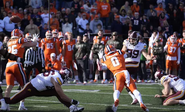 Minnesota place kicker Dragan Kesich (99) kicks a field goal during the second half of an NCAA college football game against Illinois on Saturday, Nov. 2, 2024, in Champaign, Ill. (AP Photo/Charles Rex Arbogast)