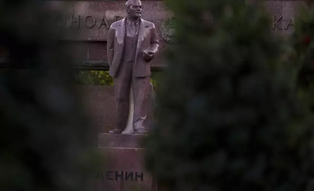 A statue of Lenin, with the words "Board of Honor" written in Cyrillic in Romanian and Russian in Chisinau, Moldova, Friday, Nov. 1, 2024. (AP Photo/Vadim Ghirda)