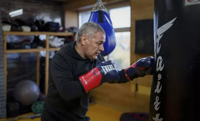 Moldovan historian and politician Octavian Ticu trains in a gym in Chisinau, Moldova, Oct. 18, 2024. (AP Photo/Vadim Ghirda)