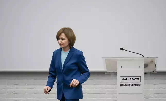 Moldova's President Maia Sandu leaves after speaking to the media during a press briefing after the polls closed for the presidential election runoff, in Chisinau, Moldova, Sunday, Nov. 3, 2024. (AP Photo/Vadim Ghirda)