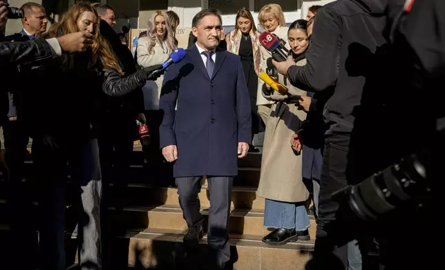 Alexandr Stoianoglo, presidential candidate of the Socialists' Party of Moldova (PSRM), leaves a voting station after casting his vote, in Chisinau, Moldova, Sunday, Nov. 3, 2024, during a presidential election runoff. (AP Photo/Vadim Ghirda)