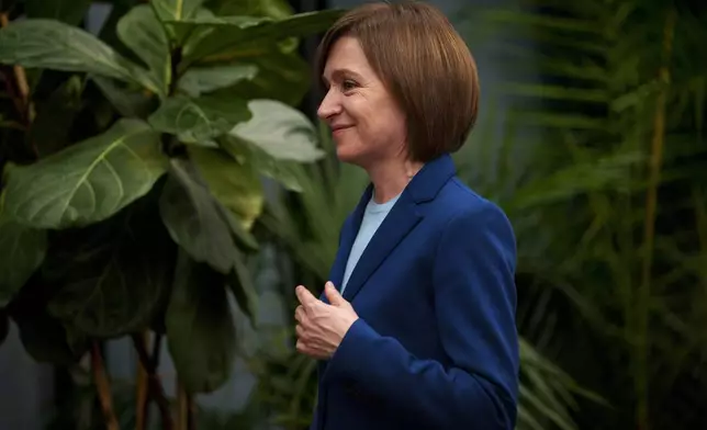 Moldova's President Maia Sandu smiles after winning a second term in a pivotal presidential runoff against a Russia-friendly opponent in Chisinau, Moldova, Monday, Nov. 4, 2024. (AP Photo/Vadim Ghirda)