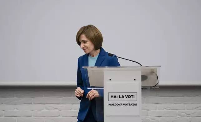 Moldova's President Maia Sandu leaves after speaking to the media during a press briefing after the polls closed for the presidential election runoff, in Chisinau, Moldova, Sunday, Nov. 3, 2024. (AP Photo/Vadim Ghirda)