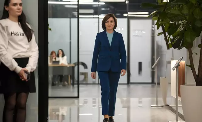 Moldova's President Maia Sandu arrives for a press briefing after the polls closed for the presidential election runoff, in Chisinau, Moldova, Sunday, Nov. 3, 2024. (AP Photo/Vadim Ghirda)