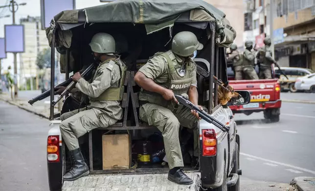 Police deploy amid opposition protests in Maputo, Mozambique, Thursday, Nov. 7, 2024. Protesters dispute the outcome of the Oct. 9 elections that saw the ruling Frelimo party extend its 49-year rule. (AP Photo/Carlos Uqueio)