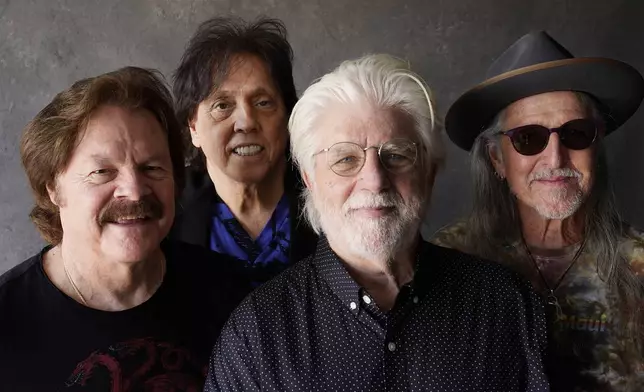 FILE - Members of the Doobie Brothers, from left, Tom Johnston, John McFee, Michael McDonald and Pat Simmons pose for a portrait in Los Angeles on Aug. 17, 2021. (AP Photo/Chris Pizzello, File)