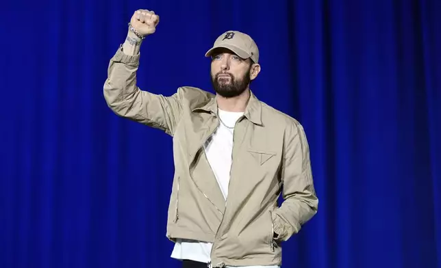 FILE - Rapper Eminem appears at a campaign rally supporting Democratic presidential nominee Vice President Kamala Harris in Detroit on Oct. 22, 2024. (AP Photo/Paul Sancya, File)