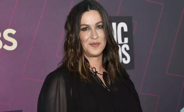 FILE - Alanis Morissette arrives at the CMT Music Awards in Austin, Texas on April 2, 2023. (Photo by Evan Agostini/Invision/AP, File)