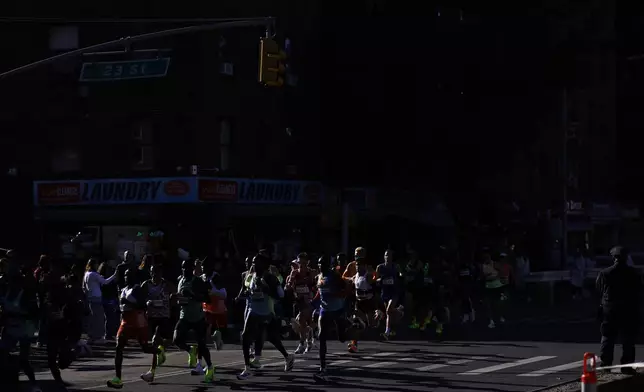 Runners in the men's elite division make their way through the Brooklyn borough during the New York City Marathon, Sunday, Nov. 3, 2024, in New York. (AP Photo/Eduardo Munoz Alvarez)