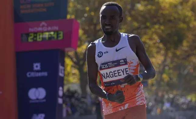 Abdi Nageeye, of the Netherlands, crosses the finish line to win the men's division of the New York City Marathon, Sunday, Nov. 3, 2024, in New York. (AP Photo/Frank Franklin II)