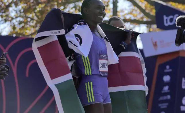 Kenya's Sheila Chepkirui smiles after winning the women's division of the New York City Marathon, Sunday, Nov. 3, 2024, in New York. (AP Photo/Frank Franklin II)