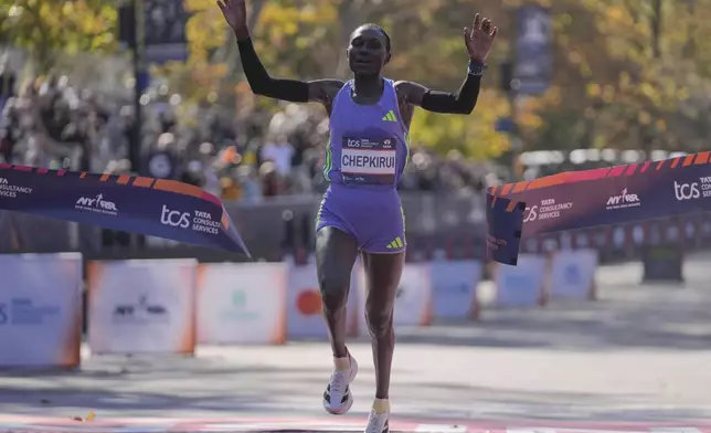 Kenya's Sheila Chepkirui crosses the finish line to win the women's division of the New York City Marathon, Sunday, Nov. 3, 2024, in New York. (AP Photo/Frank Franklin II)